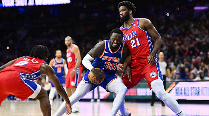 New York Knicks forward Julius Randle backs down Philadelphia 76ers center Joel Embiid